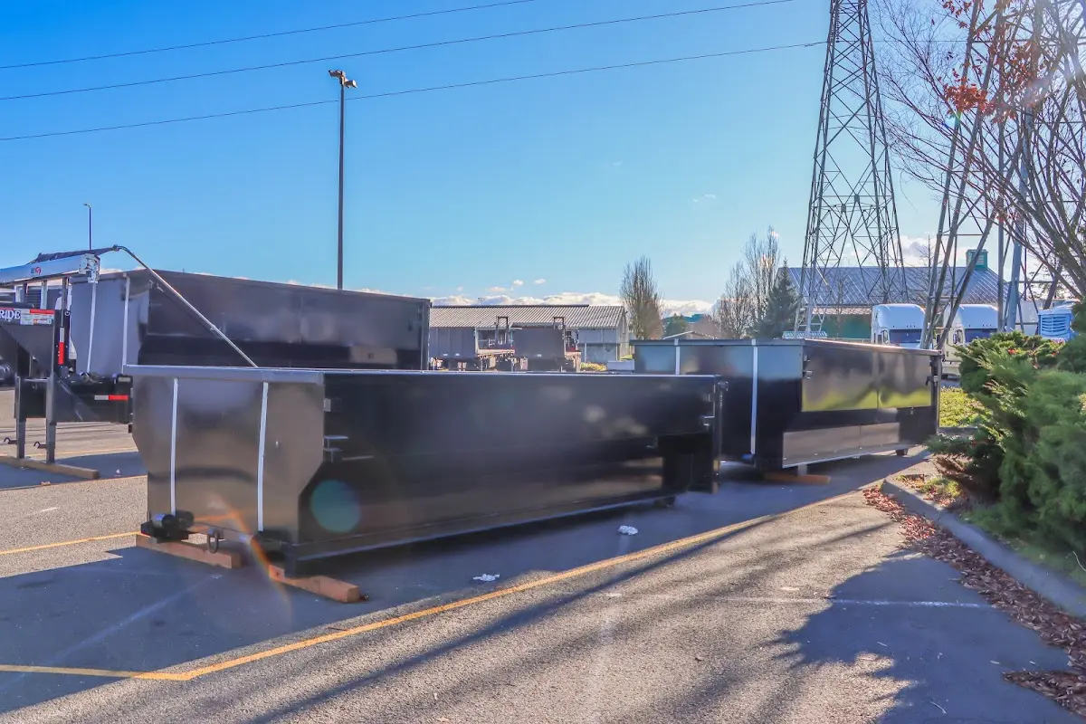 Roll-off dumpster ready for waste disposal at job site for Concrete Dumpster Rental in Ione